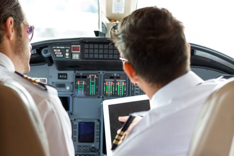 2 pilot doing a safety check in the cockpit