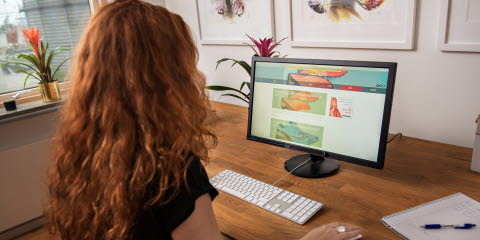Woman looking at ads on desktop