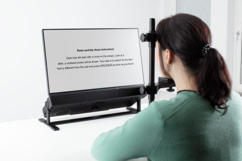 Person using Tobii Pro Chin Rest - Reading accessory