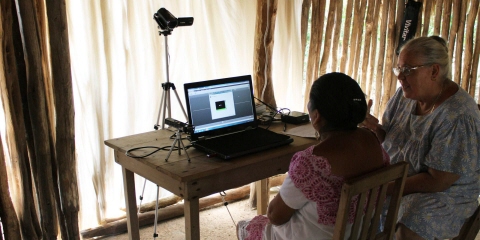Mayan test participant in front of the Tobii Pro X2-60.