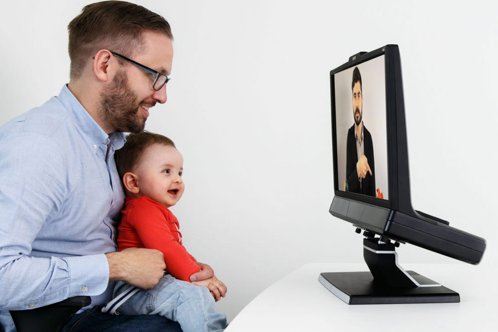 An infant looking at the Tobii Pro TX300 eye tracker's screen 