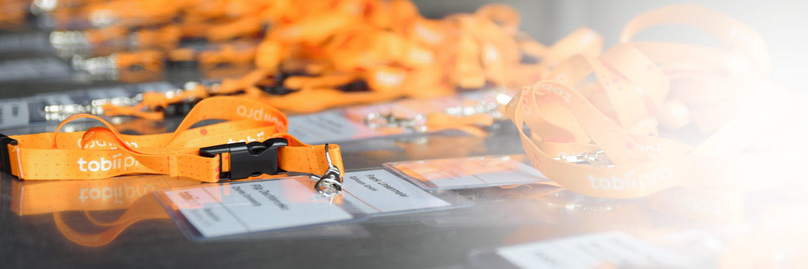 Tobii Pro conference badges on a table